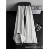 Calça de Moletom Esportiva Patchwork Xadrez Americano Masculina Nova de Alta Qualidade Solta Casual Tendência Perna Reta Calça Longa Masculina