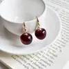 Aretes Geométricos Rojos Ankela Festivos de Año Nuevo Nicho Temperamento Venta Caliente Aretes de Botón Otoño/Invierno 2026 Venta al por Mayor de Pendientes