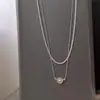 Collar de agua dulce apilado de doble capa Moda para mujer Diseño brillante de moda neta cadena para la clavícula de temperamento estilo viento frío