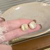Pendientes de cristal de cubo ojo de gato perla pedrería para mujer otoño e invierno lujo ligero alta gama exquisitos pendientes de moda pendientes con temperamento