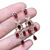 Aretes de granate color vino tinto natural, engastados en plata de ley s925, con una piedra principal impecable de 4*6 mm