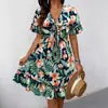 Nueva colección transfronteriza europea y americana 2025: Vestido de verano para mujer, con escote en V, estampado floral, estilo vacacional a la moda, hasta la rodilla