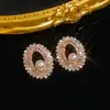 Pendientes Cruzados Transfronterizos Europeos y Americanos de Flor de Zirconia y Botón de Perla de Cobre Vintage, Pendientes Versátiles de Moda de Lujo Ligero de Gama Alta