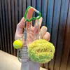 Llavero de cara sonriente de tenis con borla de cara sonriente colgante para mochila llavero de coche deportivo pequeño regalo al por mayor