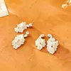 Pendientes de flor de concha románticos estilo francés, pendientes de hada con temperamento de moda de alta gama, accesorios para orejas de diseño único niche