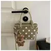 Bolso cubeta de lunares con diseño de nicho popular de verano 2026, nuevo y moderno bolso de hombro y cruzado para mujer, elegante bolso para el día a día