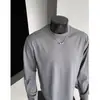 Camiseta redonda solta estilo americano para homens, camada interna casual esportiva de outono, camiseta de retalhos desconstruídos de cor sólida