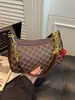 Bolso vintage floral para la axila con estampado retro, bolso nuevo con forma de luna creciente, 2026 nuevo bolso de hombro cruzado elegante de primavera