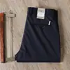 Pantalones casuales de primavera y verano para hombre, corte recto fino, antiarrugas, sin planchado, Tencel algodón, negocios, alta gama, elástico, pantalones negros