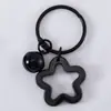 Llavero con Colgante de Campana de Estrella de Cinco Puntas de Colores Caramelo de Aleación Cubierta para Auriculares Decoración de Pareja
