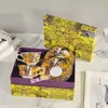 Serie de selva Dijia transfronteriza elefante indio juego de taza y platillo de café de la tarde europea juego de té de lujo caja de regalo
