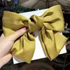 Clip de resorte con lazo de perla, accesorio para el cabello de alta gama, elegante y francés para celebridades de Internet.