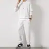 Novo conjunto de moletom em tricô waffle para homens, outono, camiseta de manga comprida cor sólida e calça comprida, esportivo e casual, atacado transfronteiriço