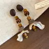 Pendientes de borla con carcasa de madera marrón transfronterizos europeos y americanos, pendientes de estilo vintage Maillard, pendientes de mujer de lujo ligero de alta gama