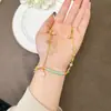 Tendencia Nacional Collar de Oro Arena Vietnamita Retro Esmalte Tubo Curvo Flor Mariposa Borla Cadena para Clavícula Joyería Elegante para Mujer Venta al por Mayor