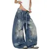 Design transfronteiriço, estilo de rua americano versátil, desgastado e rasgado, com padrões de grafite e faca curva, calça jeans longa de perna larga moderna, jeans unissex