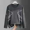Temporada de primavera y otoño, camiseta lisa popular de manga larga, corte holgado, cuello redondo, unisex, top simple y versátil