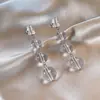 Aretes de borla de cuentas de vidrio transparente redondas con aguja plateada, aretes de moda transfronterizos europeos y americanos, aretes de lujo ligero de alta gama para mujer
