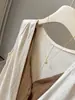 Estilo Coreano Retrô Bloco de Cores Falso Duas Peças Decote V Algodão Linho Colete Feminino Verão Novo Preguiçoso Solto Camada Cortado no Ombro Top