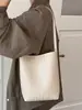 Bolso de hombro de color liso con patrón tejido, de alta calidad, retro, moderno, bolso tipo cubo casual simple y único para el día a día.