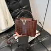 2025 Nuevo Patrón de Piedra Portátil Accesible Lujo Moda Hombro Único Retro Elegante Cruzado de Cuerpo Tendencia Bolso Cubo Pequeño para Mujer