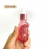 Frasco de óleo essencial ouro rosa atacado frasco de vidro pêssego conta-gotas de cabeça plástica 10ml30ml100ml pequeno frasco de amostra