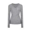 Suéter tejido negro de cuello en V para mujer, nuevo estilo coreano de otoño e invierno 2025, impresionante capa interior, top de manga larga