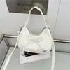 Bolsa de hombro cruzada tipo tote de gran capacidad, linda, estilo coreano, con lazo artístico transfronterizo, para uso diario 2026