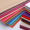 Venta al por mayor de tela para sofá lisa súper suave de felpa corta suministro al contado fondo de bolsa dura fabricantes de tela de color sólido para la venta