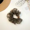 Goma para el pelo de malla con estampado de leopardo y forma de corazón 2026 Nuevo estilo para mujer Moño de alta gama Cuerda para el pelo Accesorio para el pelo extragrande