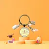 Llavero Anillo Colgante Gema del Tiempo Temporada de Graduación Transfronteriza Europea y Americana Regalo Pequeño Accesorio de Regalo Colgante de Graduación
