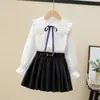 Camisa de menina Primavera e Outono nova camisa de algodão de manga comprida com gola de boneca para crianças médias e grandes camisa casual de moda para meninas