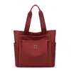 Bolsa Feminina Casual Estilo Simples 2026 Nova Grande Capacidade Moda Tecido de Nylon Bolsa de Ombro Único Bolsa de Mão Feminina da Moda Tendência