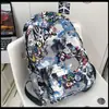 Mochila de estilo coreano de alta calidad, Ins, graffiti personalizado, moderna, genial, color contrastante, para pareja, ligera, de viaje, gran capacidad