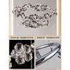 NEIWAI, un lujoso candelabro de cristal con intrincados diseños florales, perfecto para salas de estar, villas y salones principales, con un sofisticado diseño de anillo redondo y un marco metálico