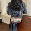 Bolso de mano tejido de paja estilo vacacional para mujer, bolso tote pequeño de uso diario para mujer, nuevo bolso cruzado elegante y versátil para el trabajo de verano 2026