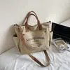 Diseño de Bolsa de Lona Serie de Bolsos Otoño e Invierno Nicho Estilo Perezoso Bolsa de Tela Más Vendida Bolso Tote de Hombro para Viajar Bolso Cruzado