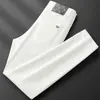 Jeans blancos de alta gama Lyocell para hombre, tres pruebas, nuevos jeans ajustados skinny elásticos para otoño e invierno con forro polar y diseño engrosado