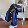 Pantalones casuales para hombre 2026 nuevo estilo moda Hong Kong modernos holgados adelgazantes a rayas rectos de pierna ancha pantalones de chándal deportivos ropa para hombre