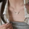 Colar de pérolas com pingente de coração estilo leve feminino com design de nicho e corrente de clavícula 2024 novo estilo elegante colar