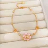 Pulsera y anillo chapados en oro real de 18 quilates, diseño de flor de goteo de aceite y cordero, un accesorio lujoso y de alta gama para el dedo índice