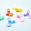 Nuevo Estilo Cortado Cara Amor Llavero Colgante Color Caramelo Campana Accesorios DIY Bolso de Pareja Auriculares Colgante Accesorios
