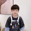 2026 Nuevo Modelo Mochila Infantil Guardería Bebé Mini Mochila con Cuerda de Tracción para Niños y Niñas Mochila de Exterior