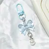 Llavero de lazo colorido con perlas, accesorios hechos a mano para fundas de teléfono, audífonos, bolsos y accesorios de ropa