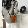 Chaqueta de plumón de nuevo estilo transfronteriza, bolsa para teléfono, bolso de hombro, bolso de mano versátil de moda, bolso cruzado de alta gama de moda coreana