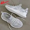 Zapatillas para hombre Warrior 2026 verano nuevas transpirables casuales zapatillas ligeras para correr zapatillas de punto fly-knit para hombre