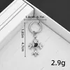 Pendientes de aro con colgante de cruz de diamante negro en forma de corazón de alta gama, clips para orejas, unisex, pendientes oscuros, tachuelas, stock de fábrica