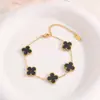 Pulsera de Trébol de Cuatro Hojas Clásica de Moda Lujo Ligero Sensación de Gama Alta para Mujer Doble Cara de Concha Acero de Titanio Dorado 18K Bestseller Transfronterizo