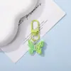 Llavero colgante de resina de color caramelo simulación de mariposa DIY accesorio de llave con cuentas de dibujos animados decoración creativa para bolsa