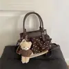 Outono 2026 Nova Elegante Nicho Fofa Estampa Simples Versátil Grande Capacidade Chique Bolsa de Ombro Bolsa Transversal Bolsa de Mão